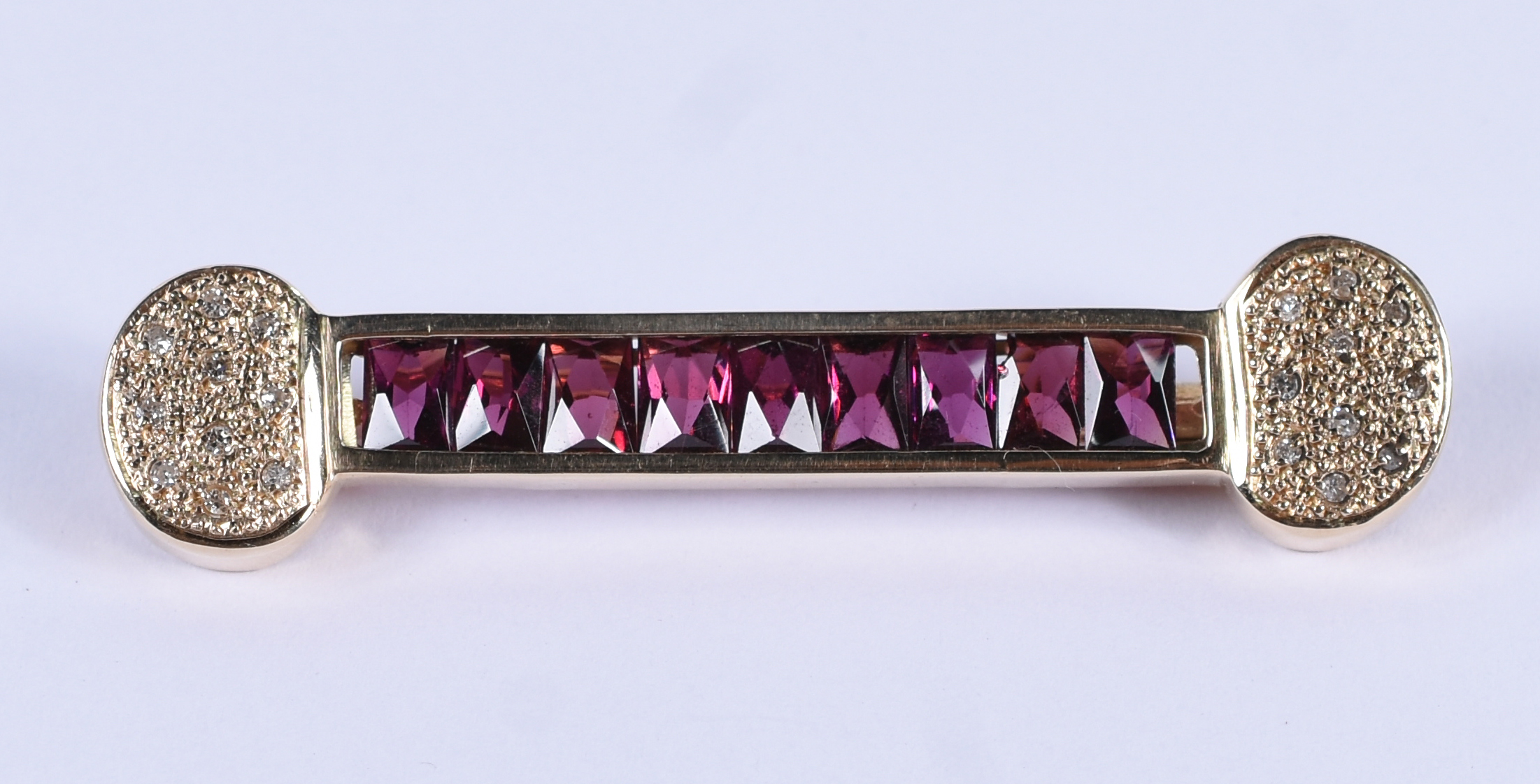 Barrete de ouro 18k com brilhante e turmalina rosa.(Por questão de... - foto 1 de 3