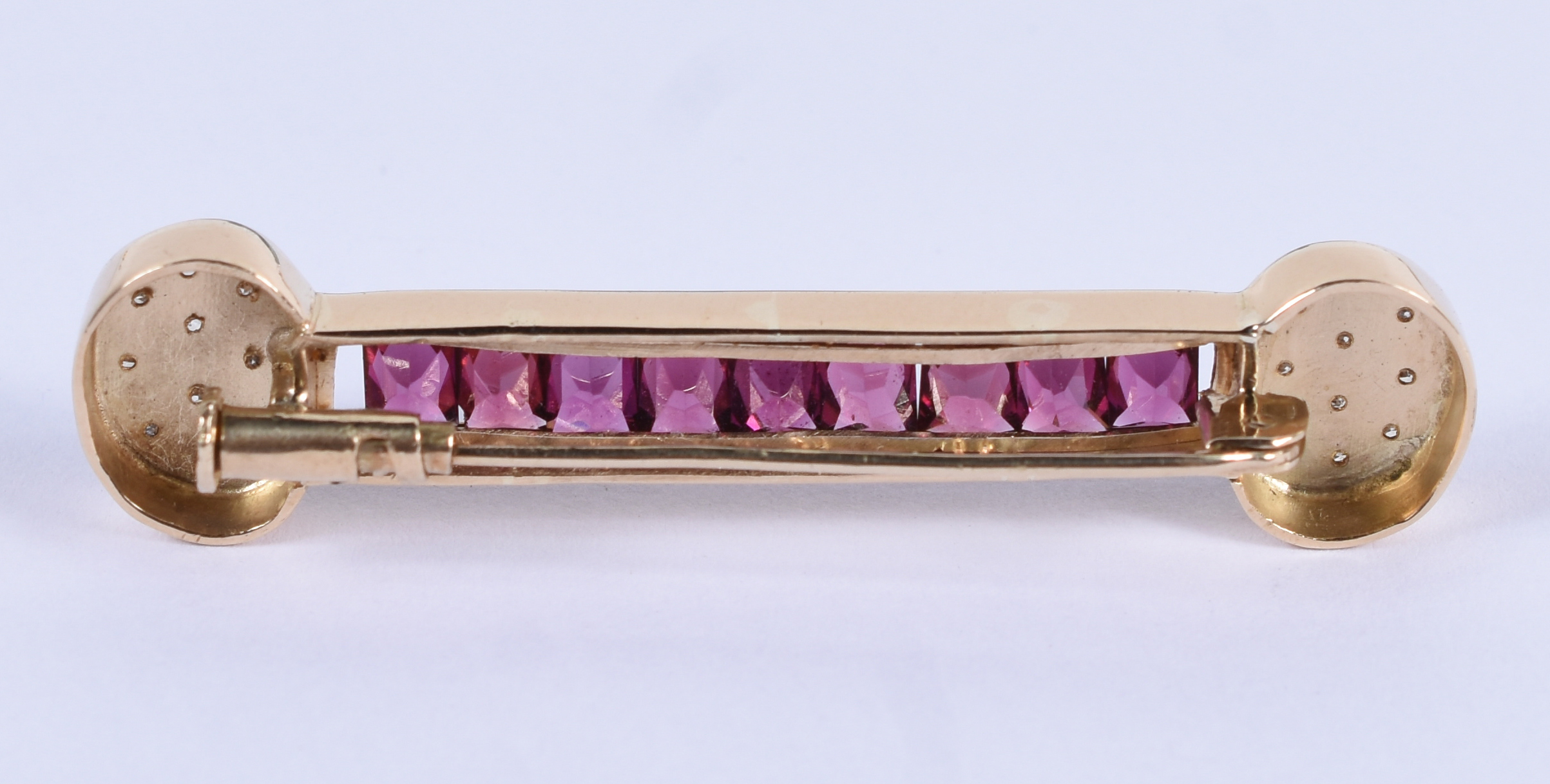 Barrete de ouro 18k com brilhante e turmalina rosa.(Por questão de... - foto 2 de 3