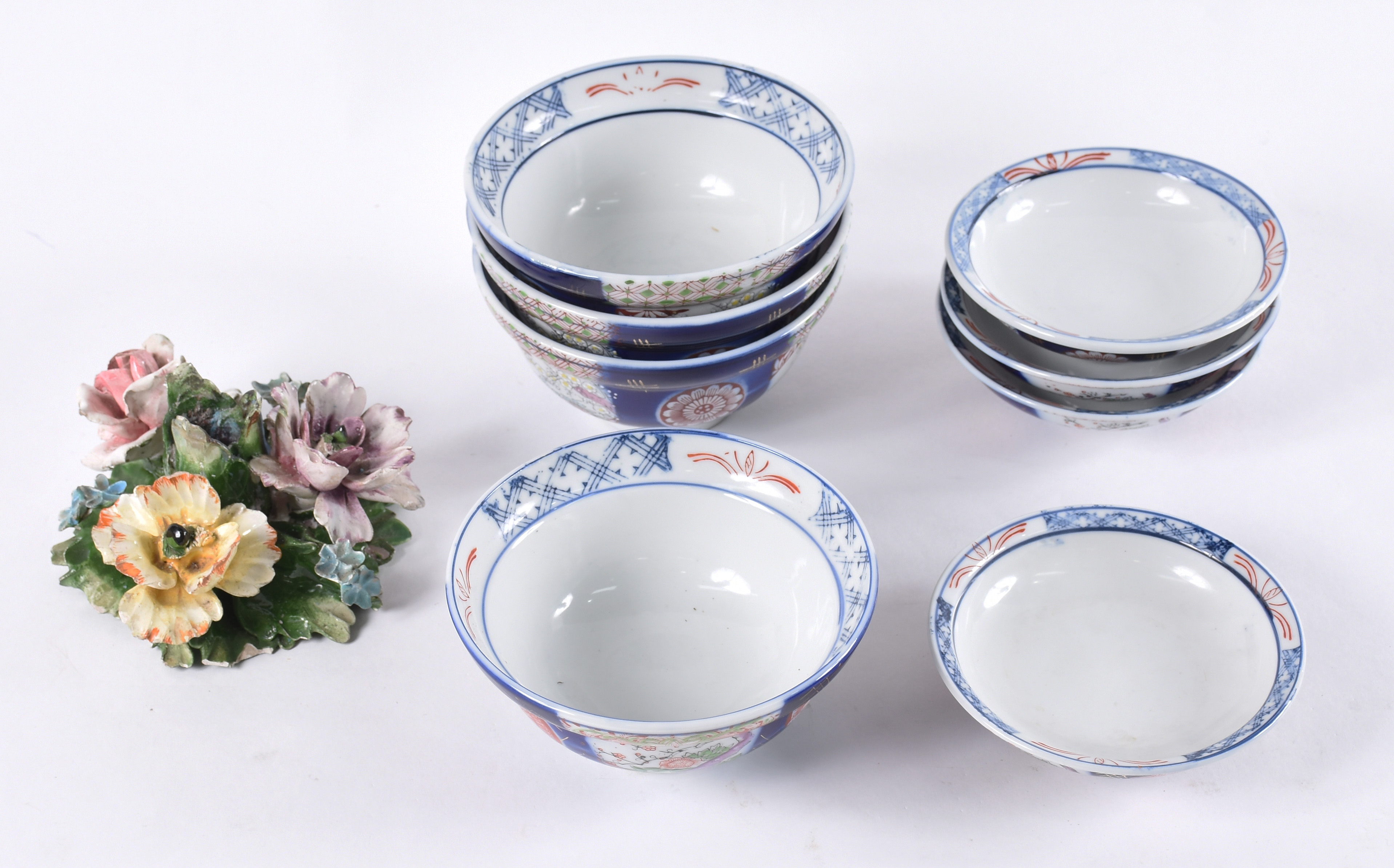 Quatro bowls orientais com pratinhos e 1 castiçal em forma de flor(... - foto 1 de 5