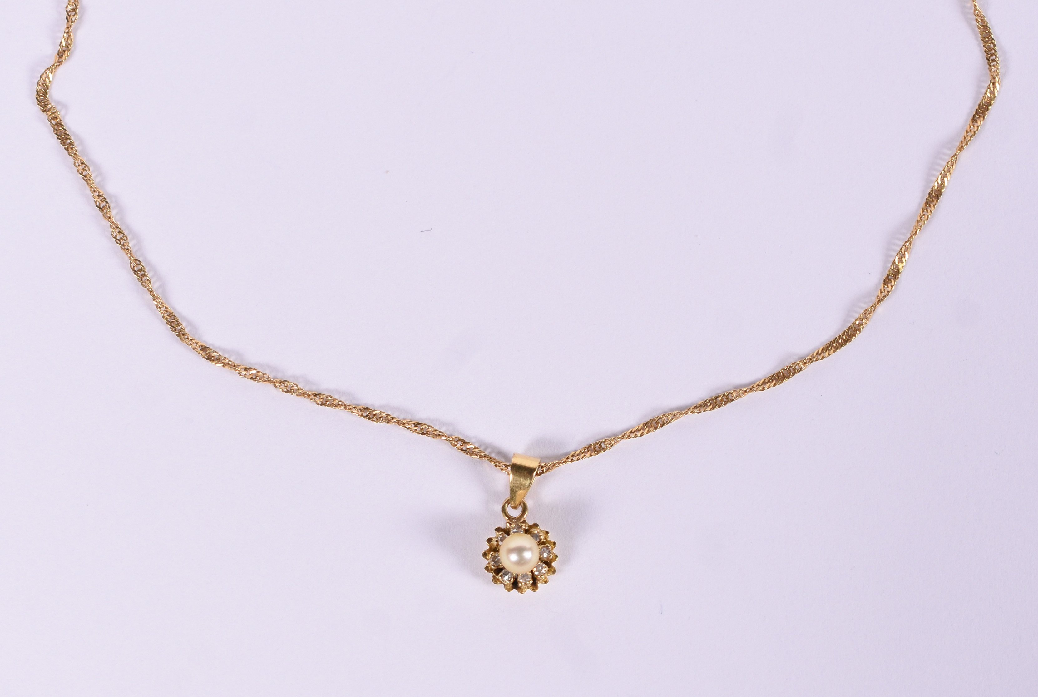 Colar de ouro amarelo 18 k e pingente de perola e brilhante... - foto 1 de 5