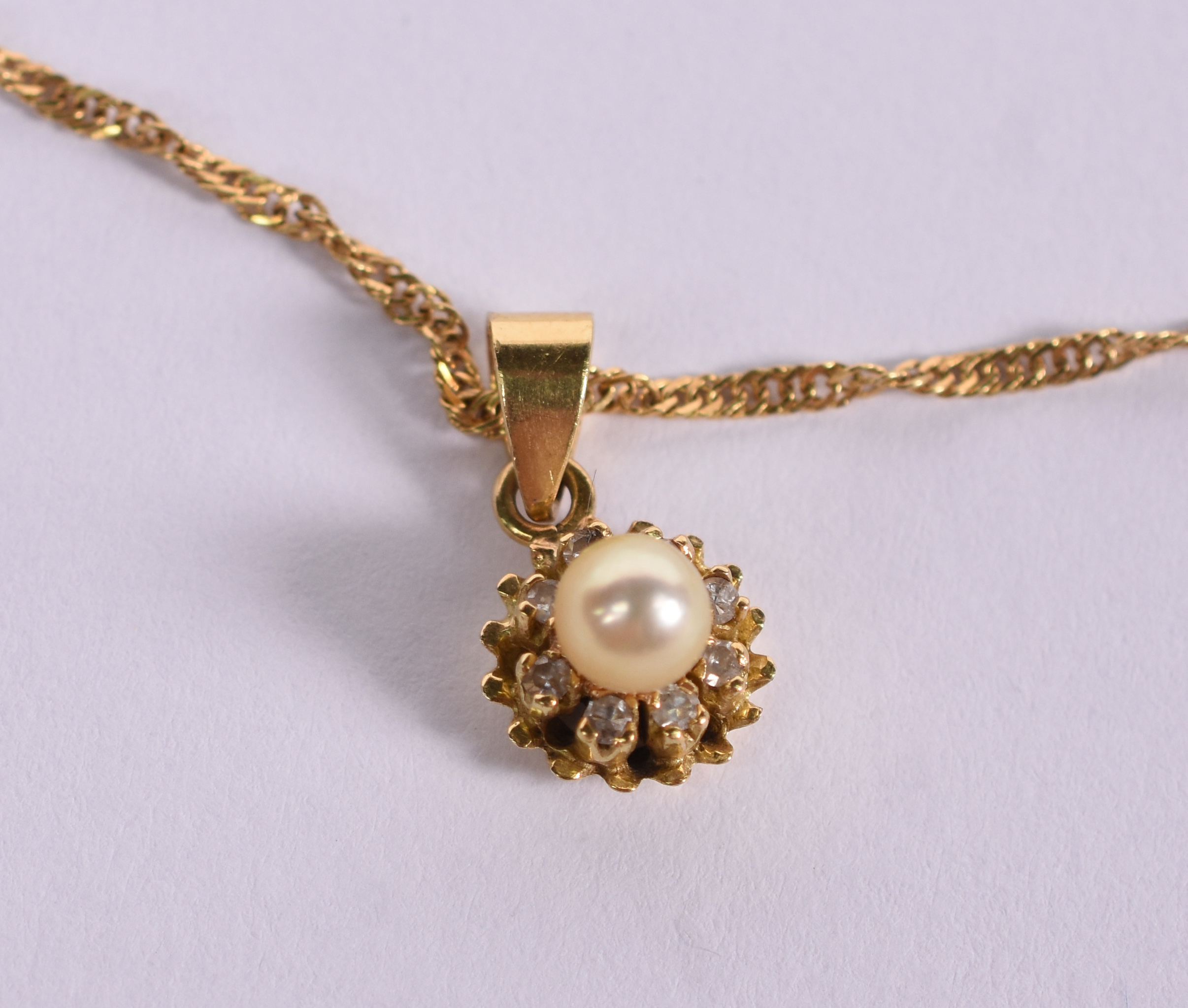 Colar de ouro amarelo 18 k e pingente de perola e brilhante... - foto 5 de 5