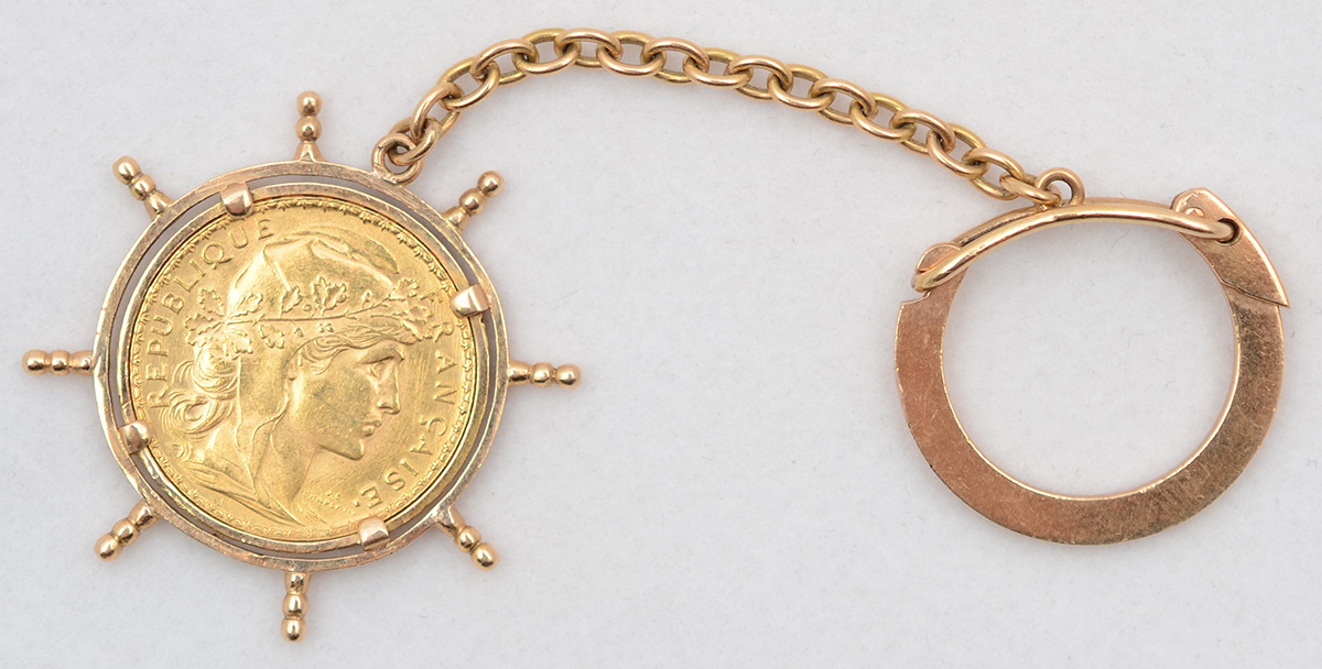 Chaveiro em ouro 18 k e moeda em 22 k - 20 Francos da França. Peso... - foto 1 de 2