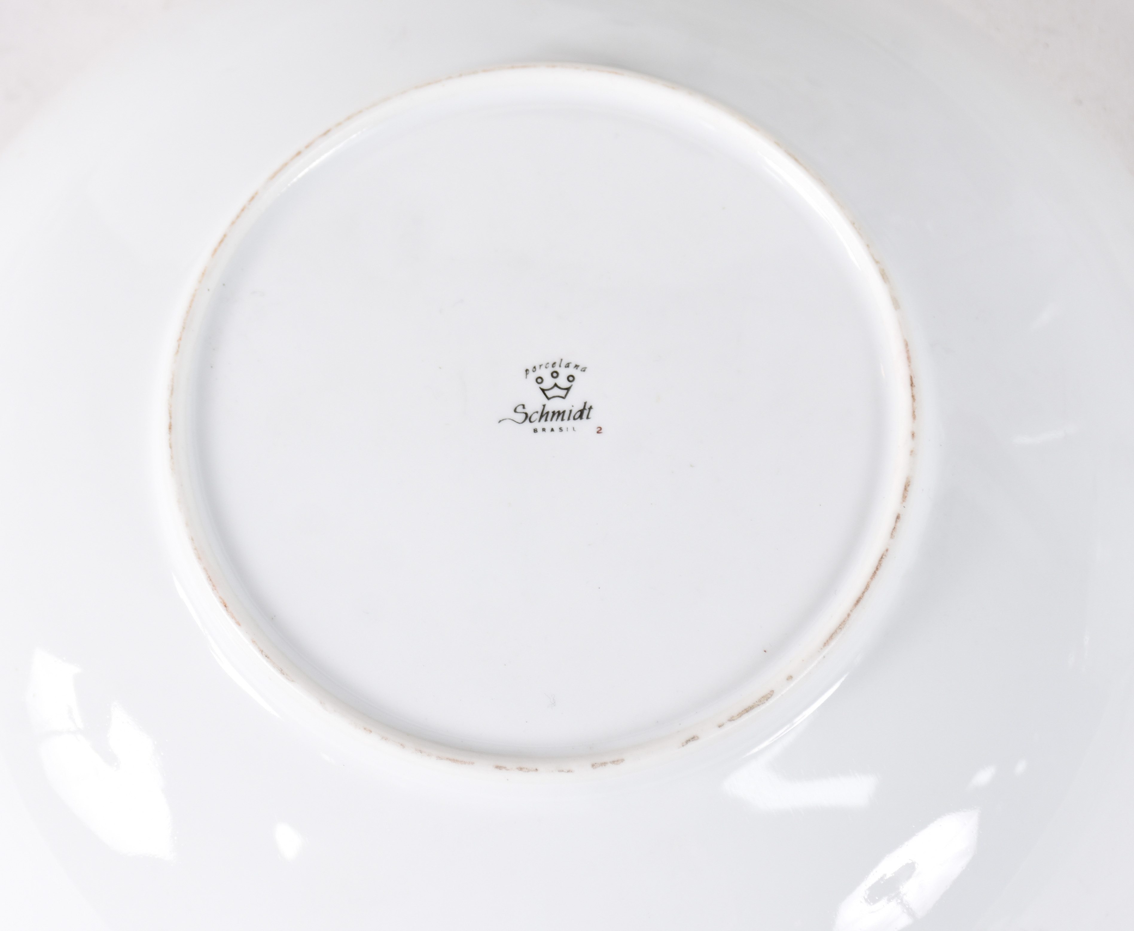 Aparelho de jantar de porcelana Schmidt, sendo 11 pratos rasos, 11... - foto 4 de 4