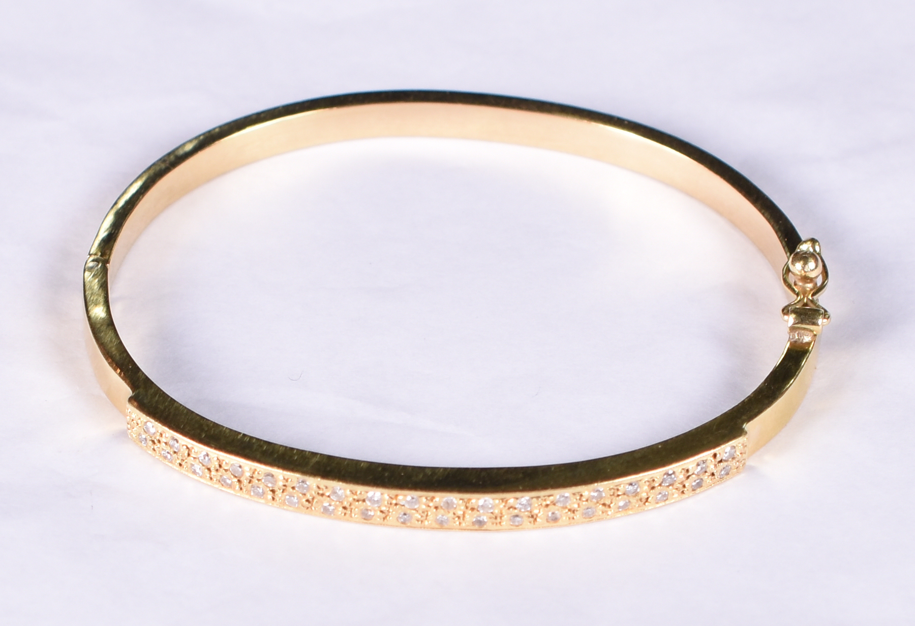 Pulseira de ouro amarelo 18 k tipo escrava com 20 brilhantes. - foto 1 de 3