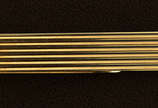 Cartier - Prendedor de gravata em ouro 14 k, nu... - Cartier - Prendedor de gravata em ouro 14 k, numerado 9717, peso total aproximado 4.25 g e medindo 3,6 x 0,4 cm.