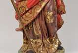 São Paulo, Séc. XX - Imagem brasileira em madeira policromada e dourada representando São Paulo - Apresenta-se com ricas vestes em largos pregueados, segurando a espada, s