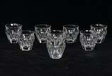 Baccarat (1764),  - Baccarat - Lote composto de 8 copos para licor em cristal francês translúcido com bojo facetado.<br>Peça marcada na base.<br><br>Por questões de segur