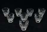 Baccarat (1764),  - Baccarat - Lote composto de 8 copos para licor em cristal francês translúcido com bojo facetado.<br>Peça marcada na base.<br><br>Por questões de segur