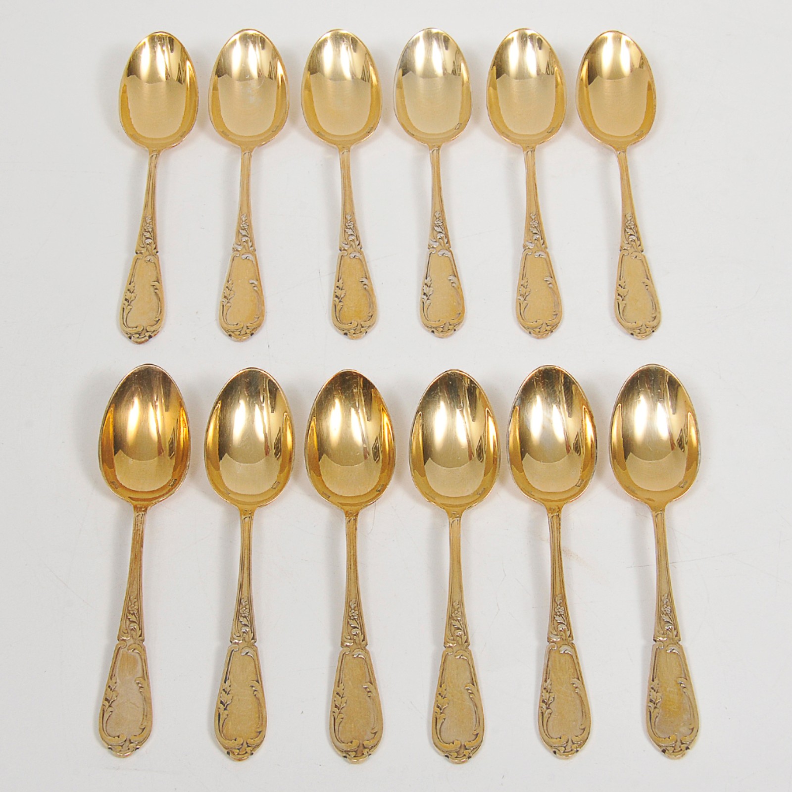Conjunto de 12 colheres para café em metal dourado com cabos... - foto 1 de 3