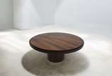 Joaquim Tenreiro (1906-1992), Mesa, Déc.60 - Mesa de jantar com base cilíndrica executada em madeira compensada com laminação em jacarandá e detalhe em aço inoxidável, tampo circular maciço. Bras