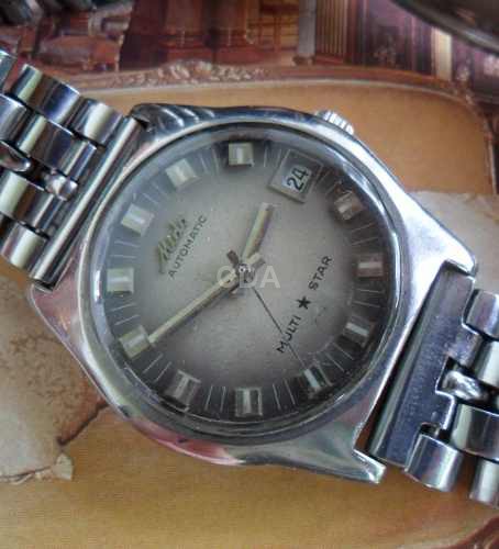 relogio mido multi star