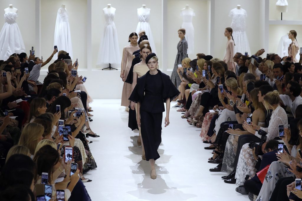 Models present creations by Christian Dior at the end of the 2018-2019 Fall/Winter Haute Couture collection fashion show in Paris, on July 2, 2018. / AFP PHOTO / FRANCOIS GUILLOT