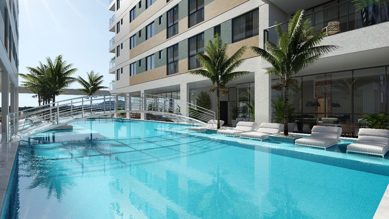 Em Construção em Porto Belo, com 77,05m² área privativa sendo 2 suítes, 2 vagas de garagem, área de lazer completa