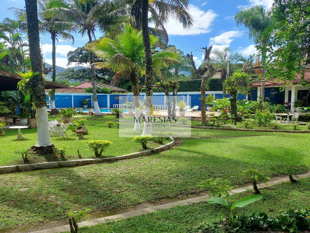 Casa com piscina a menos de 300 metros da praia Boiçucanga