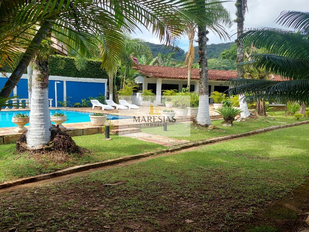 Casa com piscina a menos de 300 metros da praia Boiçucanga