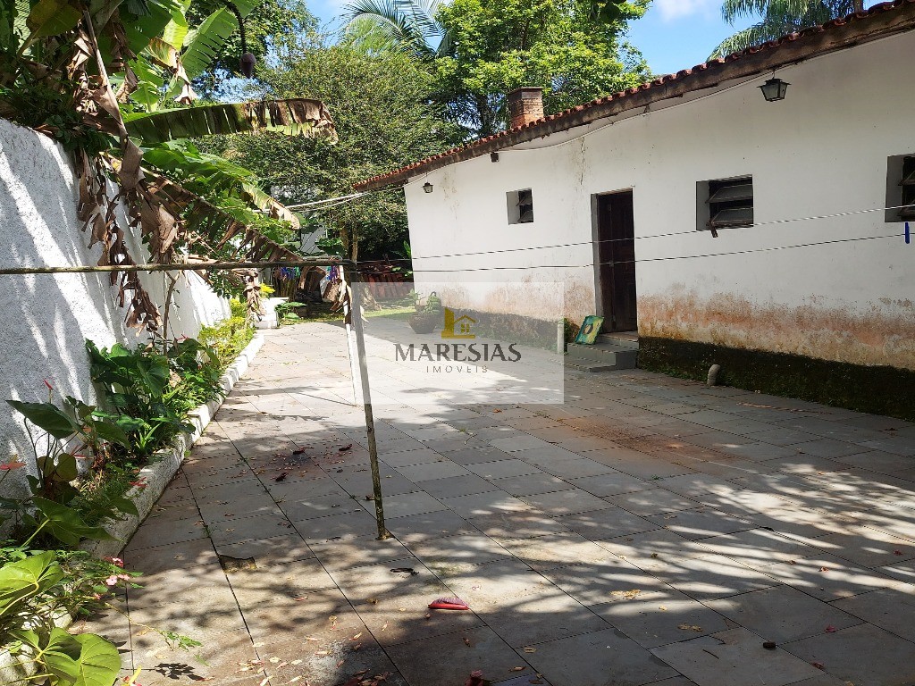Casa com piscina a menos de 300 metros da praia Boiçucanga