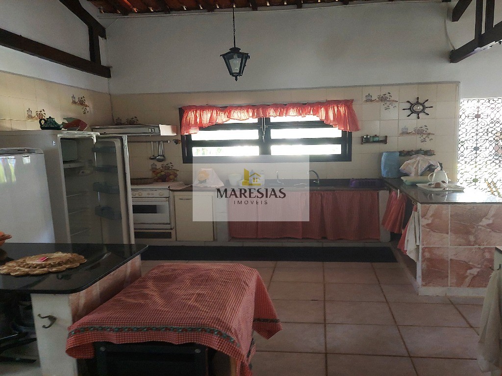 Casa com piscina a menos de 300 metros da praia Boiçucanga