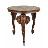 <p>Mesa indiana redonda de madeira entalhada, decorada com incrustações em marfim vegetal representando o Taj Mahal e animais emoldurados por motivos florais. Pernas esculpidas em forma de cabeça de elefante, com ricos detalhes decorativos - Diâm 50 x 60 cm alt</p>