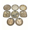<p>Lote com oito pratinhos de apoio, de prata 800 e 833, de formatos circular e quadrado, com bordas decoradas em diferentes padrões. Para apoio de copos, taças ou pequenos objetos, medindo 10 cm de diâmetro o maior - 332 g</p>