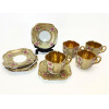 <p>Conjunto com 30 xícaras de café com seus 25 pires, de porcelana brasileira DP, mod 541, com rica decoração floral, com interior dourado (algumas peças com douração no estado)</p>