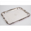 <p>CHRISTOFLE, Travessa de metal espessurado à prata, finamente ornamentada com parras de uvas em relevo, parte central com monograma P.A.R. 39 x 31cm. França, início séc. XX</p>