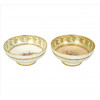 <p>PARAGON, Par de bowls de faiança esmaltada, ornamentados com douração e motivos florais, marca da manufatura sob a base. Alt 05 x 11 cm cada. Inglaterra, início séc. xX</p>