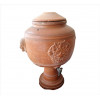 <p>Talha de barro cozido, ornamentada com brasão em reserva central, alças laterais em forma de faces estilizadas. Alt. 60 x 35cm (Aproximadamente). Séc. XIX</p>