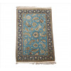 <p>Tapete persa Isfahan, campo azul-turquesa com composição integral de botehs, arabescos florais e palmetas de inspiração safávida, borda principal azul-marinho com decoração vegetalista clássica em tons de marfim, dourado e castanho, 216 x 140 cm = 3,02 m². Início século XX.</p>