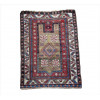 <p>Tapete caucasiano Kazak, pequeno formato, decoração geométrica sobre campo marfim com medalhão losangular central e motivos tribais estilizados em vermelho, azul e rosa antigo, cercaduras múltiplas com elementos angulares típicos das tecelagens do Cáucaso, 158 x 113cm = 1,73 m², Cáucaso, início do século XX (rape por igual)</p>