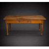 <p>Mesa rústica de madeira nobre lavrada, tampo em forma retangular, gaveta frontal e pernas torneadas. Brasil séc. XIX.</p> <p>Mesa rústica de madeira nobre lavrada, tampo em forma retangular, gaveta frontal e pernas torneadas. Brasil séc. XIX.</p>