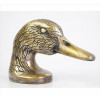 <p>SANTA RITA, Abridor de garrafas de metal dourado, representando figura de cabeça de pato, marca da manufatura sob a base. Alt. 09 x 12 x 05cm.</p>