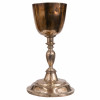 <p>Raro cálice litúrgico em prata. Copo liso, fuste em balaústre e base circular alteada. Sem marcas, Salvador, Bahia, trabalho atribuível ao séc. XVIII (c. 1750/1770). Peso: 560 gramas. Dimensões: 25 x ø14 cm.</p>