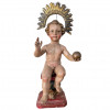 <p>Imagem em madeira representando menino Jesus. Acompanha resplendor em prata, batida, repuxada e cinzelada da mesma época. Portugal, século XVIII. 43 cm (sem resplendor) e 53 cm (com resplendor).</p>
