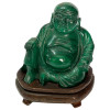 <p>Escultura representando buda, em pedra na cor verde. China, século XX. Acompanha sua base original. 10 x 9 cm.</p>