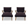 <p>Elegante par de poltronas produzidas na década de 1950, com estrutura em madeira maciça ricamente marchetada, evidenciando o requinte artesanal e a atenção ao detalhe típicos do mobiliário modernista brasileiro do período. Dimensões: Altura 76 cm × Largura 70 cm × Profundidade 56 cm</p>