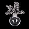 <p>RENÉ LALIQUE - Elegante perfumeiro francês em cristal translúcido, criação de René Lalique, mestre vidreiro e um dos maiores nomes do Art Déco. O modelo “Clairefontaine”, concebido em 1931, apresenta tampa decorada com delicadas flores em acabamento satiné, contrastando com o corpo polido e transparente. Peça de coleção assinada “Lalique France” na base. A tampa encontra-se levemente emperrada, sem prejuízo estético. Dimensões: Altura 12 cm × Largura 9,7 cm × Profundidade 6 cm</p>