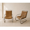 <p>MIES VAN DER ROHE - Par de cadeiras modelo Cantilever, com estrutura tubular cromada e assento estofado. 83 x 63 x 87 cm.</p>