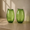 <p>KENZO MURANO - Par de vasos em vidro artístico de Murano, assinados, na tonalidade verde translúcida, de linhas suaves e elegantes. 38 cm de alt.; 22 cm de diâm.</p>