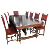 <p>Mesa de jantar para dez convivas. ART NOUVEAU (1890-1910). Madeira maci&ccedil;a, entalhada e colunatas torneadas. S&oacute;lida estrutura da base em colunas profusamente decoradas. Assentos refeitos. Medidas: 102 x 46 x 46 cm. (cadeiras), 75 x 230 x 113 (mesa aberta) e 75 x 147 x 113 (mesa fechada).</p>