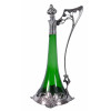 <p>WMF - GERMANY (W&uuml;rttembergische Metallwaren Fabrik)<br />MODELO: 191*. <br />Bojo original em vidro verde. <br />Estrutura em pewter decorado com figuras femininas.<br />Banho de prata refeito, acr&eacute;scimo de rolha para estabilidade da tampa.<br />Pe&ccedil;a marcada, reproduzida fotograficamente no livro WMF 1906, p&aacute;gina 37.<br />*Foto em anexo.<br />Medidas: 36 x 18 x 22 cm. <br /><br />Em 1860, Daniel Straub, juntamente com os irm&atilde;os Louis e Friedrich Schweizer, fundaram a metal&uacute;rgica na Alemanha. Poucos anos depois, em 1862, foi premiada com medalha de distin&ccedil;&atilde;o na exposi&ccedil;&atilde;o mundial em Londres. <br />Em 1880 fez fus&atilde;o com a Ritter & Co que, e juntou-se ao Wurttemberg Union Bank ganhando o nome WMFW&uuml;rttembergische Metallwarenfabrik. Desde sua funda&ccedil;&atilde;o, o crescimento da WMF foi tremendo, transformando-se, no final dos anos 1900, no maior produtor e exportador mundial de utens&iacute;lios dom&eacute;sticos de metal com grande entrada nos mercados russo, austr&iacute;aco, e alem&atilde;o. <br />O foco da WMF em tecnologia e design permitiu produzir pe&ccedil;as inovadoras no estilo Jugendstil populares entre os colecionadores e consideradas as melhores do estilo Art Nouveau na Alemanha e na &Aacute;ustria.<br />Seja em termos de estilo Art Nouveau ou Art Deco, o design foi um componente chave para o sucesso da empresa. Entre 1895 e 1915, Albert Mayer, Peter Behrens e Hans Peter desenvolveram a maioria dos projetos e criaram obras expressivas, levando-a a crescer e abrir subsidi&aacute;rias no Reino Unido, Pol&ocirc;nia, Dresden, Berlim e Viena.<br />Seus produtos foram exibidos nas Exposi&ccedil;&otilde;es Universais de Paris, Viena e Chicago, onde receberam pr&ecirc;mios e aclama&ccedil;&atilde;o. <br />Em 1883, WMF come&ccedil;ou a fabricar seus pr&oacute;prios cristais em Geisslingen, perto de Stuttgart. A f&aacute;brica foi destru&iacute;da durante a Primeira Guerra Mundial e reinaugurada, mais moderna em 1922, quando Karl Wiedmann aperfei&ccedil;oou a t&eacute;cnica de cristais iridizados, o chamado MYRA. Produzidos de 1926, at&eacute; 1936.<br />Albert Mayer, projetou muitos dos produtos Art Nouveau com figuras e perfis femininos inspirados em Alphonse Mucha que constam no Cat&aacute;logo de 1906.<br />Com a funda&ccedil;&atilde;o do Departamento de Produtos Decorativos Contempor&acirc;neos (NKA) da WMF em 1925, sob a orienta&ccedil;&atilde;o de Hugo Debachin proporcionou oportunidades para artistas e designers experimentarem uma alternativa &agrave; produ&ccedil;&atilde;o em massa.<br />Designers not&aacute;veis,como Richard Riemerschmid, criaram pe&ccedil;as para atender a uma clientela consciente do design. <br />A WMF, em 1925, fundou o Departamento de Produtos Decorativos Contempor&acirc;neos (NKA)<br />Em 1927 estreou sua linha Cromagem na Feira de Leipzig de 1927.<br />Hoje a WMF pertence ao grupo franc&ecirc;s Soci&eacute;t&eacute; d'Emboutissage de Bourgogne. <br />A WMF (W&uuml;rttembergische Metallwarenfabrik) foi uma renomada f&aacute;brica de produtos em metal fundada em 1853 em Geislingen, na Alemanha.</p>
