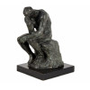 Escultura em bronze maciço, redução do clássico de Rodin O Pensador. <br />Medidas: 40 x 25 x 25 cm. Altura da base: 4 cm.<br />PESO: 17,100 KG