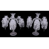 BACCARAT<br />Grande par de candelabros em cristal Baccarat.<br /><br />Medidas: 65 x 56 x 56 cm. e 47 x 45 x 45 cm.