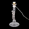<p>Maison Baccarat. Luminaria de mesa em cristal fosco na figura de puti. Nao acompanha cúpula. Marca em relevo na base. Leve bicado na base. Eletrificaçao revisada e adaptada ao padrão nacional. França, 1940. 33 cm alt.</p>
