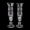 <p>Cristallerie Baccarat. Par de candelabros em cristal transparente modelo bambou. Mangas com decoraçao ao ácido. Selo da maison nas peças. França, 1940. 41 cm alt.</p>