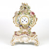 <p>Jacob Petit &ndash; Bel&iacute;ssimo rel&oacute;gio de mesa em porcelana esmaltada e policromada, no estilo rococ&oacute;, com rica ornamenta&ccedil;&atilde;o floral em alto-relevo e aplica&ccedil;&otilde;es em dourado. Medida completa: 44 x 30 x 22 cm. Somente a base: 11 x 30 x 22 cm. (No estado)</p>