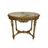 <p>Mesa de apresentação em madeira lavrada e dourada, com rico entalhe em alto-relevo, representando motivos vegetais, com quatro pés e tampo de mármore. França, séc. XIX. 77 cm de alt.; 90 x 60 cm.</p> <p>Mesa de apresentação em madeira lavrada e dourada, com rico entalhe em alto-relevo, representando motivos vegetais, com quatro pés e tampo de mármore. França, séc. XIX. 77 cm de alt.; 90 x 60 cm.</p>