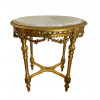 <p>Mesa auxiliar em madeira entalhada e dourada, com tampo de mármore. 80 cm de alt.; 70 x 56 cm.</p> <p>Mesa auxiliar em madeira entalhada e dourada, com tampo de mármore. 80 cm de alt.; 70 x 56 cm.</p>