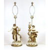 <p>Par de abajures em metal dourado e patinado, representando figuras femininas. 64 cm de alt.</p> <p>Par de abajures em metal dourado e patinado, representando figuras femininas. 64 cm de alt.</p>