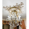 <p>Lustre de teto no estilo Maria Theresa, com estrutura em metal dourado, corpo ricamente adornado com cristais lapidados em formato de gotas. 80 cm de alt.; 65 cm de di&acirc;m. A retirada deste lote, bem como o transporte, &eacute; de inteira responsabilidade do comprador.</p>