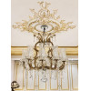 <p>Lustre estilo Maria Theresa, com estrutura em bronze dourado e bra&ccedil;os revestidos por cristais lapidados, com rica decora&ccedil;&atilde;o de pendentes de cristal em formato de am&ecirc;ndoas. 91 cm de alt.; 70 cm de di&acirc;m. A retirada deste lote, bem como o transporte, &eacute; de inteira responsabilidade do comprador.</p>